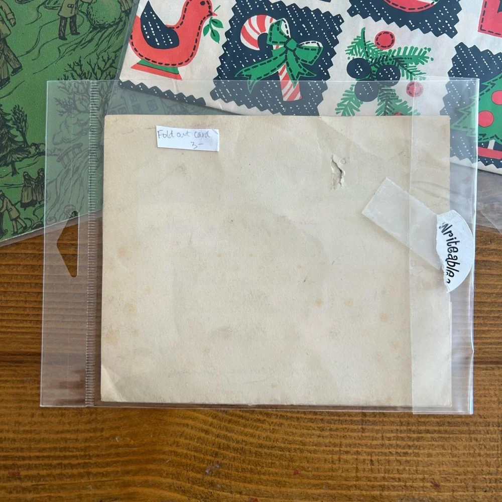 Bundle of vintage Christmas wrapping papers and card
